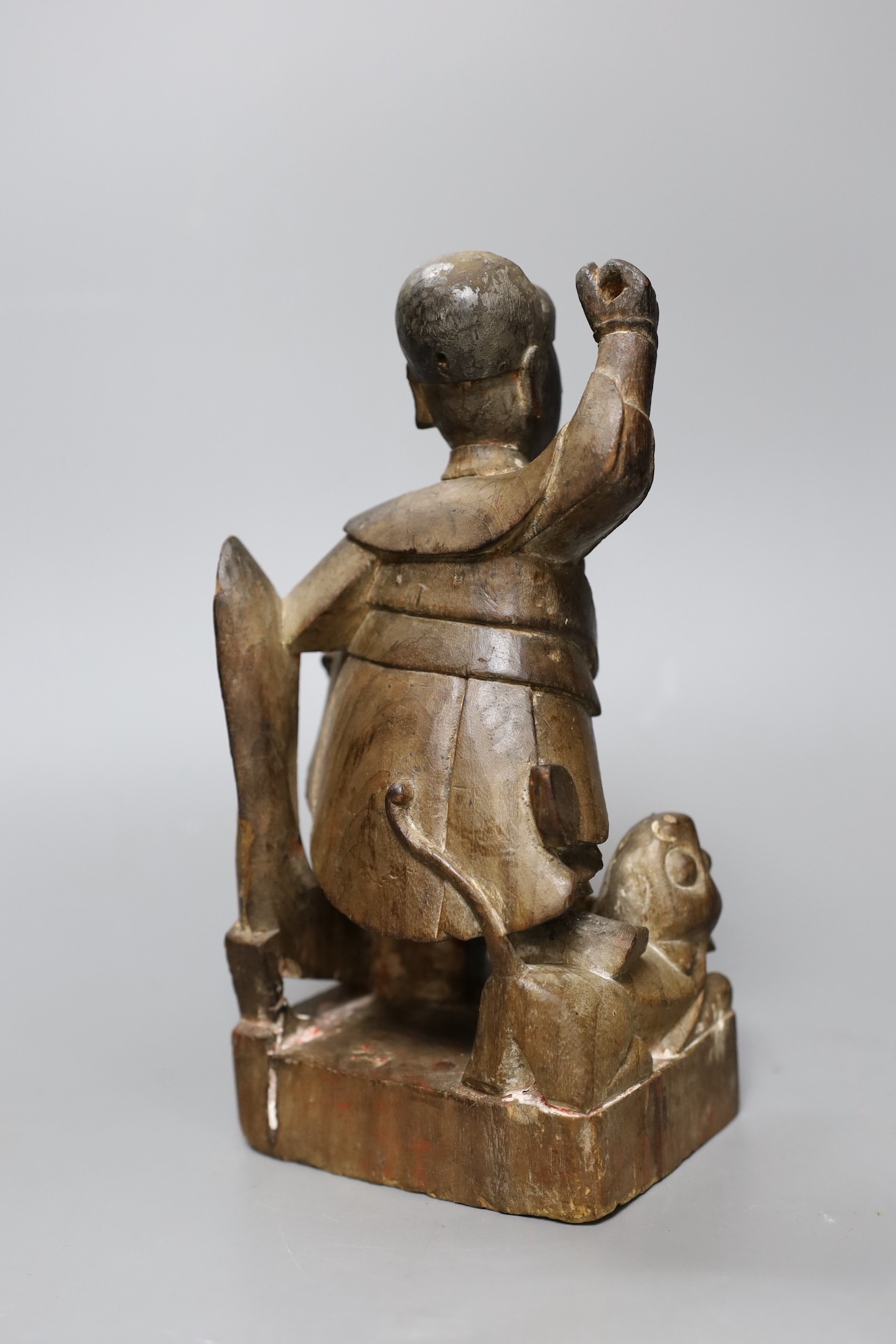 A Chinese Qing dynasty carved wood figure, 23cm tall